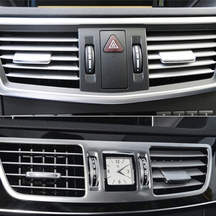 Silver air vent outlet tab clips on the central dashboard air vents