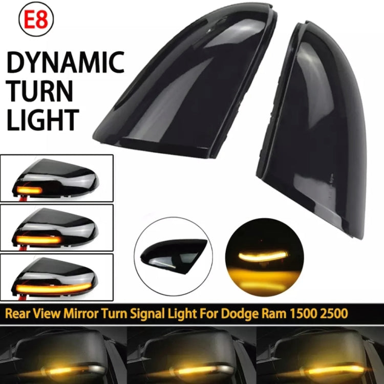 Rearview mirror dynamic turn signal light with glowing amber LED strip, side angle.