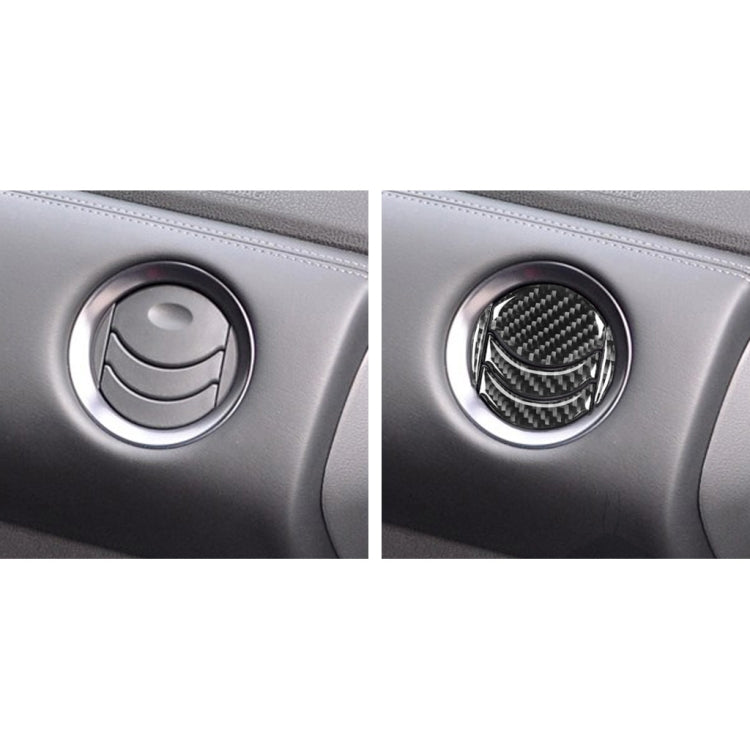 Dashboard central air outlet trim with carbon fiber sticker over circular vent