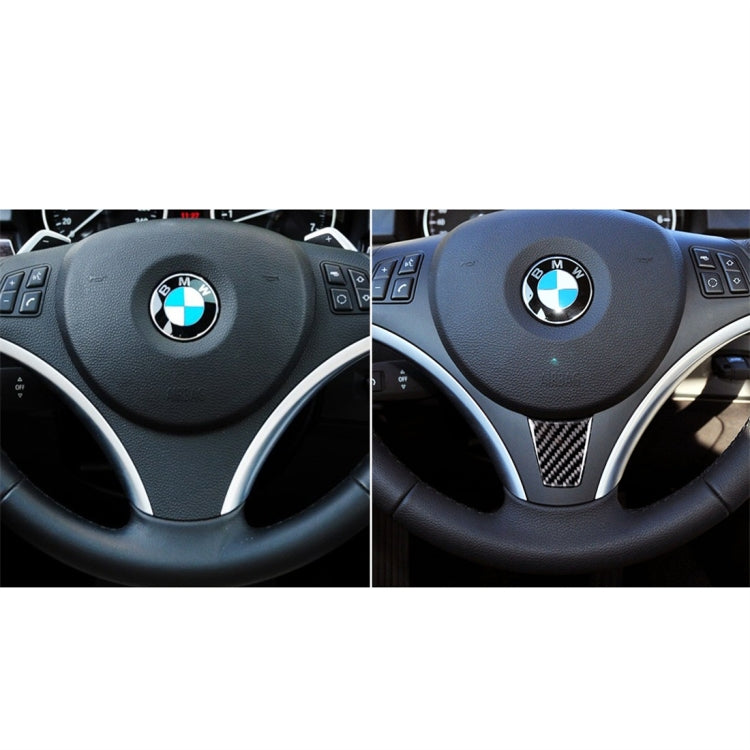 Carbon-fiber steering wheel trim sticker on steering wheel spoke center area