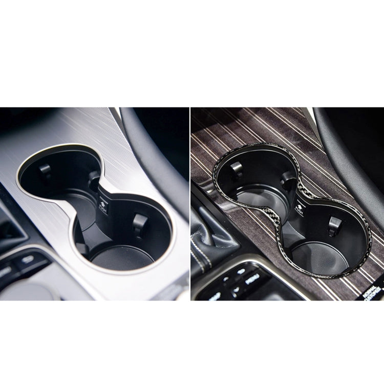 Installed carbon fiber cup holder frame sticker around twin cup holders, black