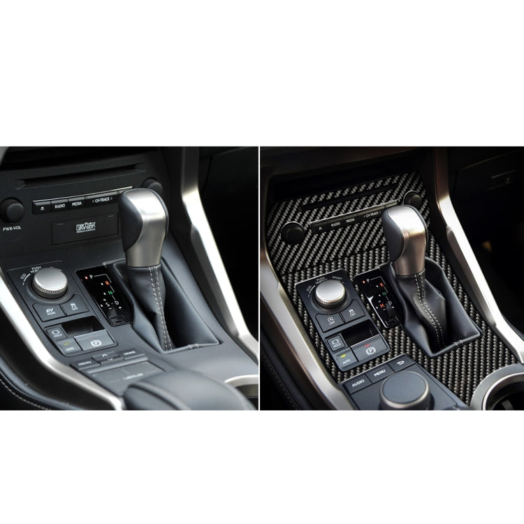 Center console CD panel with carbon fiber trim sticker installed over controls