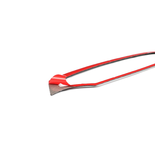 Carbon fiber dashboard trim sticker edge with red backing tab and adhesive strip