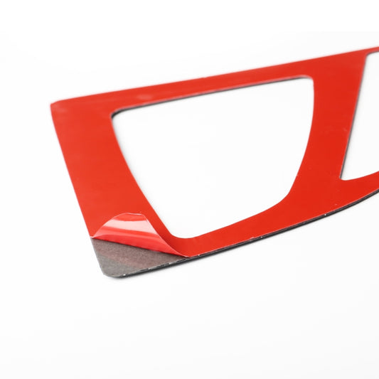 Carbon fiber gear panel sticker with white cutout window; red backing visible