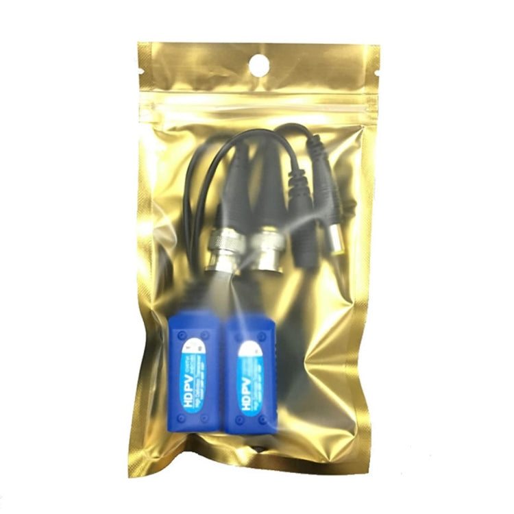 Two passive balun transceivers in blue housings inside a metallic gold package bag