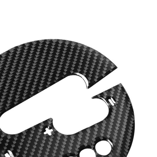 Close-up of carbon fiber look gear shift panel sticker with curved cutout