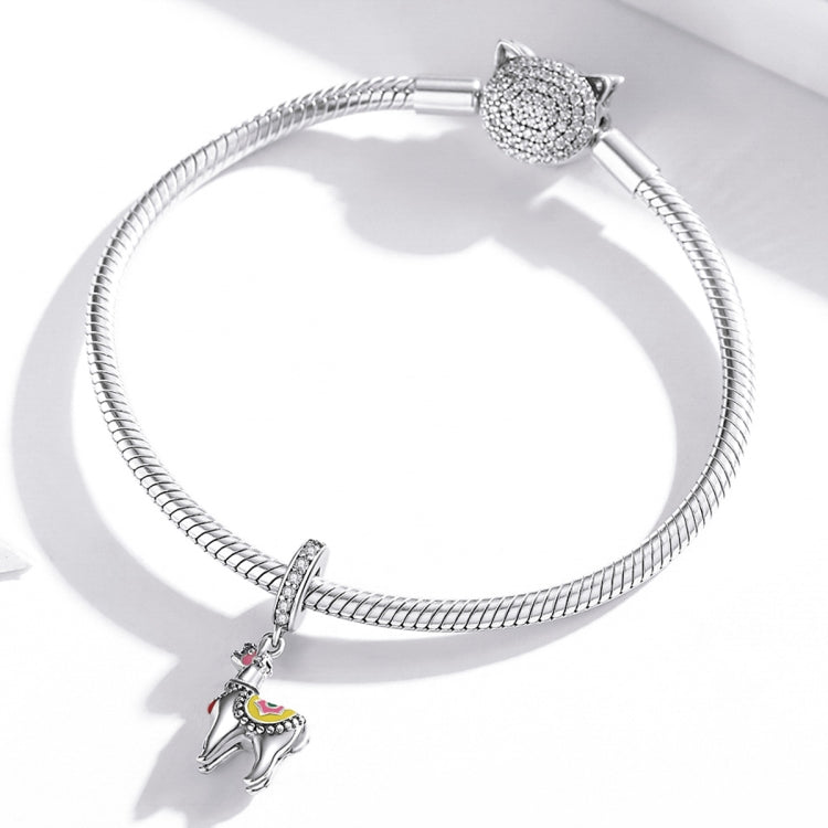 Silver snake-chain bracelet with CZ clasp and dangling alpaca charm