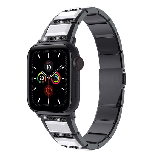 Two-tone steel Apple Watch band with black center links and silver/white accents