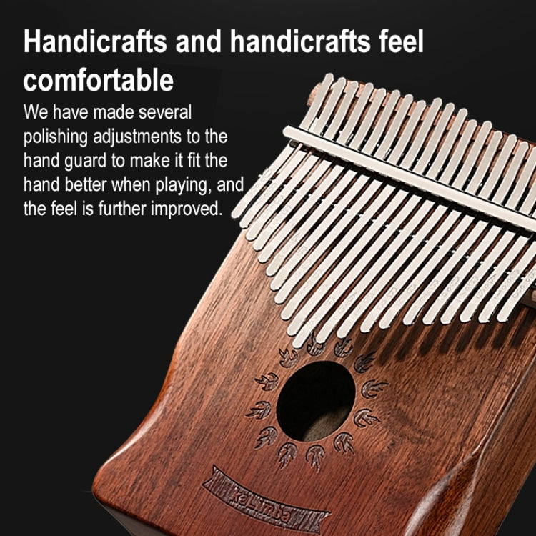 Angled brown wooden 21-key thumb piano kalimba with metal tines and sound hole