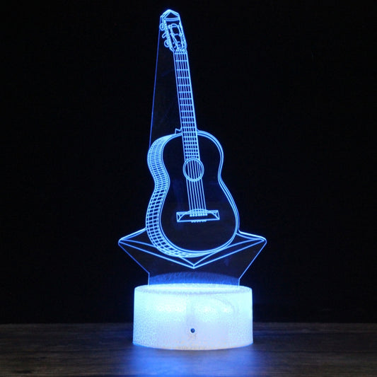 LED guitar-shaped 3D night light with blue glowing acrylic design on round base