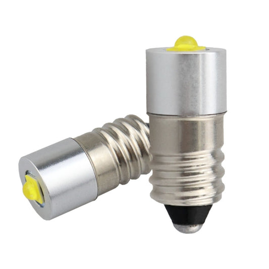 E10 LED bulb with silver metal casing and yellow LED lens, side view