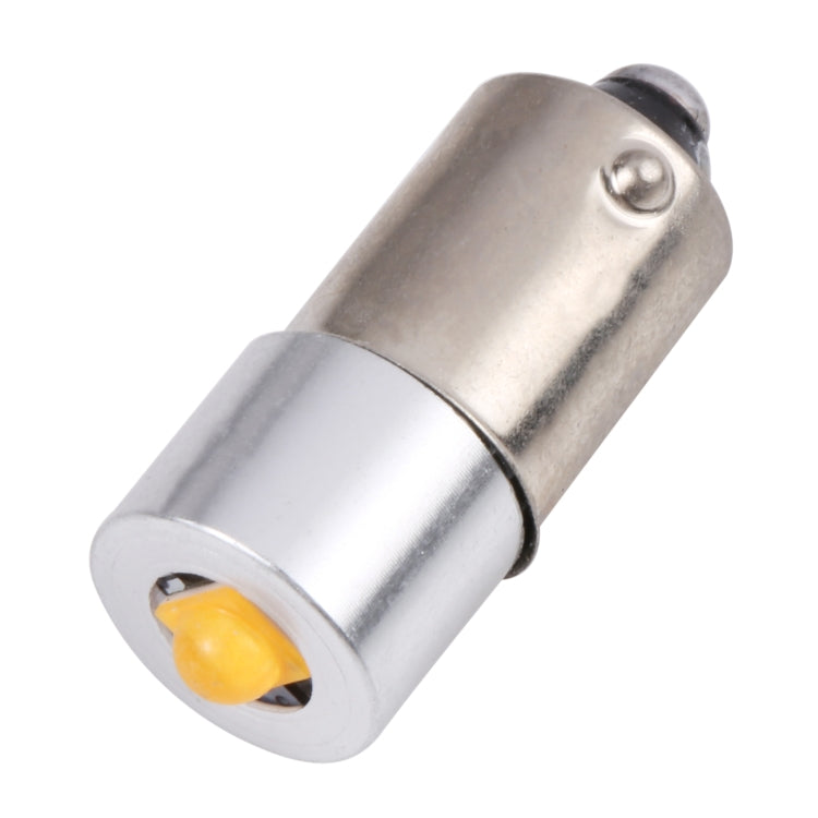 BA9S LED bulb close-up with silver sleeve and yellow LED chip