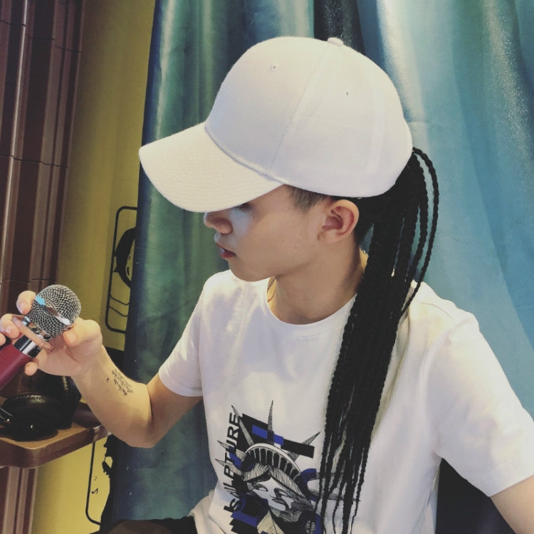 Dreadlocks wig hat with white cap and long black braided hair, profile worn view.