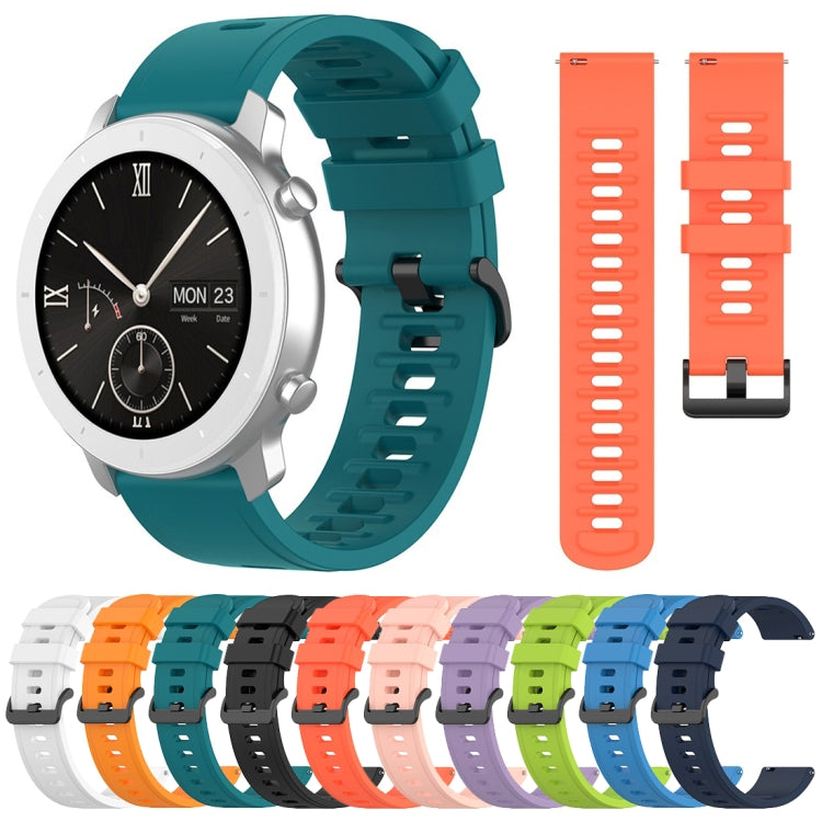 Assorted silicone smartwatch replacement straps in multiple colors, including orange and teal