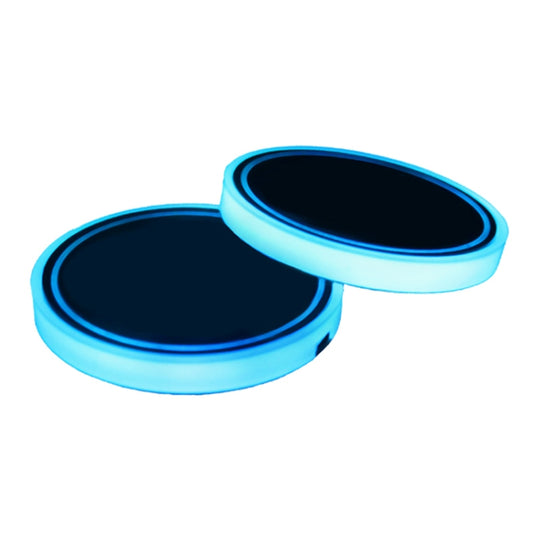 Pair of blue glowing circular LED car cup holder lights
