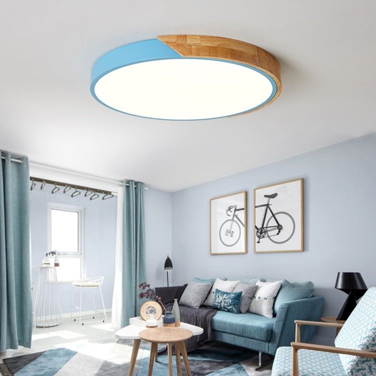 Blue-ring round LED ceiling lamp with wood accent and glowing white panel
