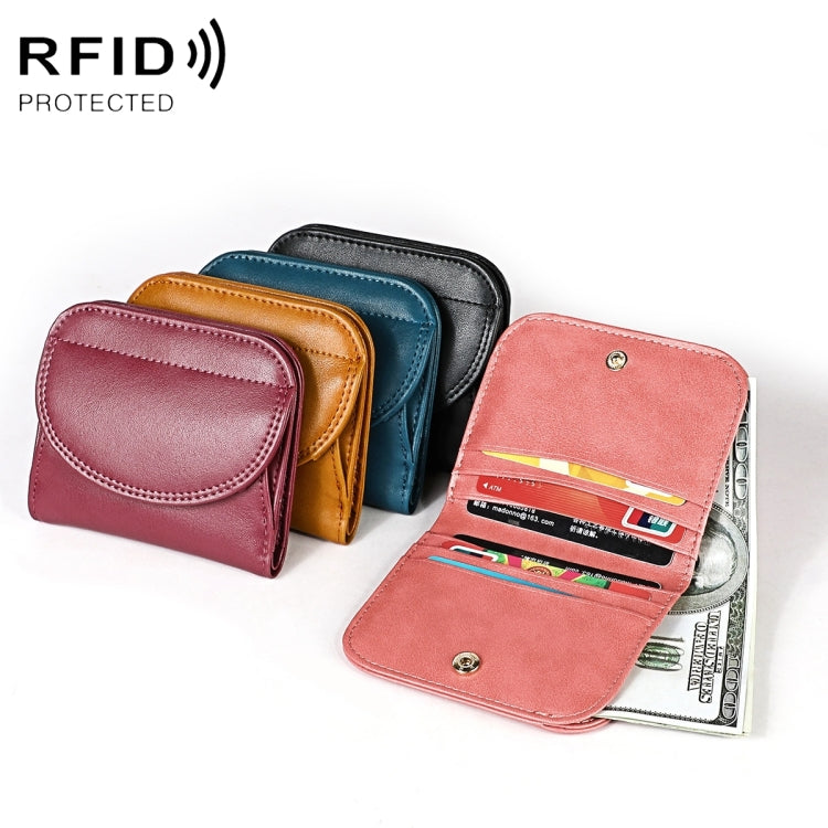 Pink folding RFID coin purse with snap, open to card slots and compartments