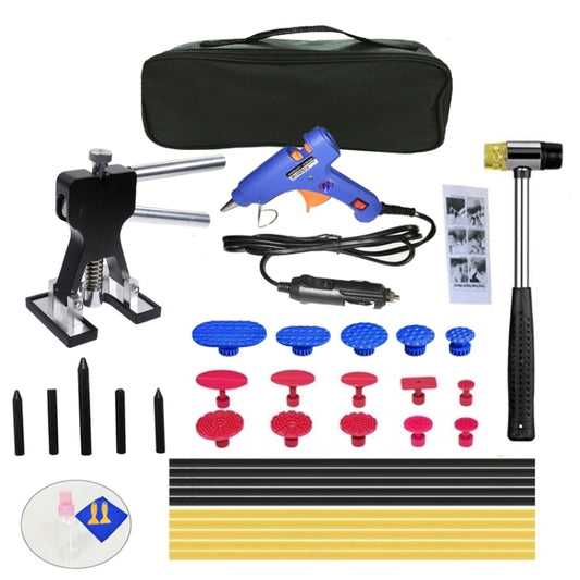 Paintless dent puller kit with black case, blue glue gun, and suction pads