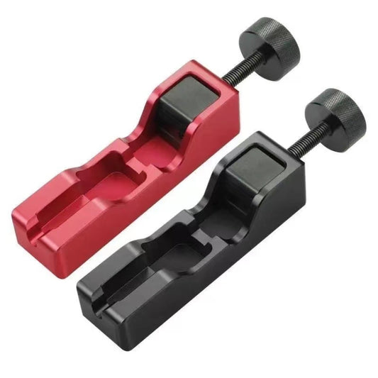 Spark plug gap tool with red clamp and black adjustment screw knob