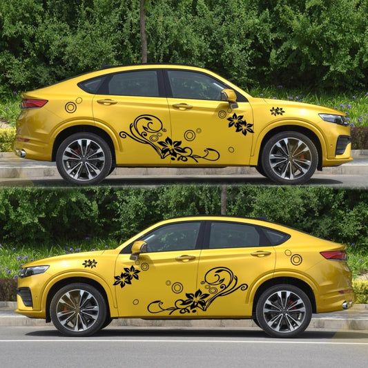 Car decorative stickers on yellow car with black floral vine and swirl motifs, 2 pcs