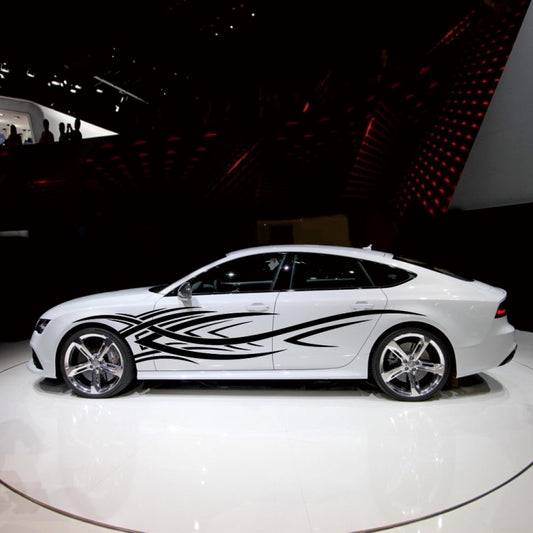 White sports car with black tribal totem graphic decals on side panels