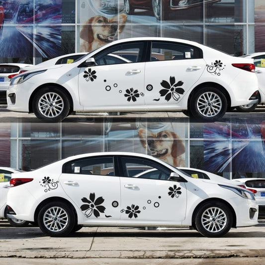 White car side panel with black flower and swirl decorative stickers