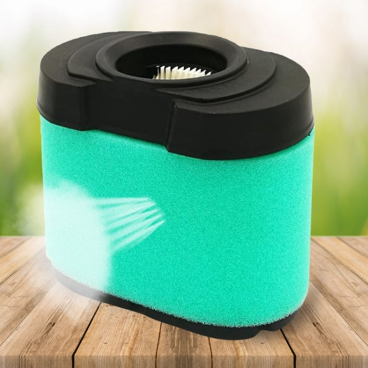 Green foam air filter with black housing and top inlet opening