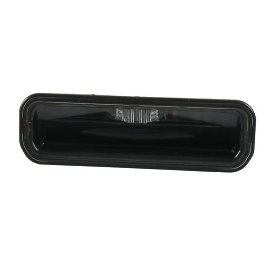 Black trunk door switch housing with centered clear light lens