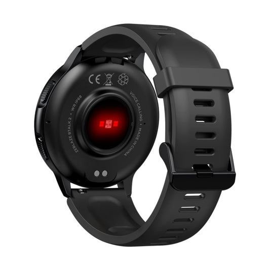 Black round smart watch back with red indicator light and black silicone strap