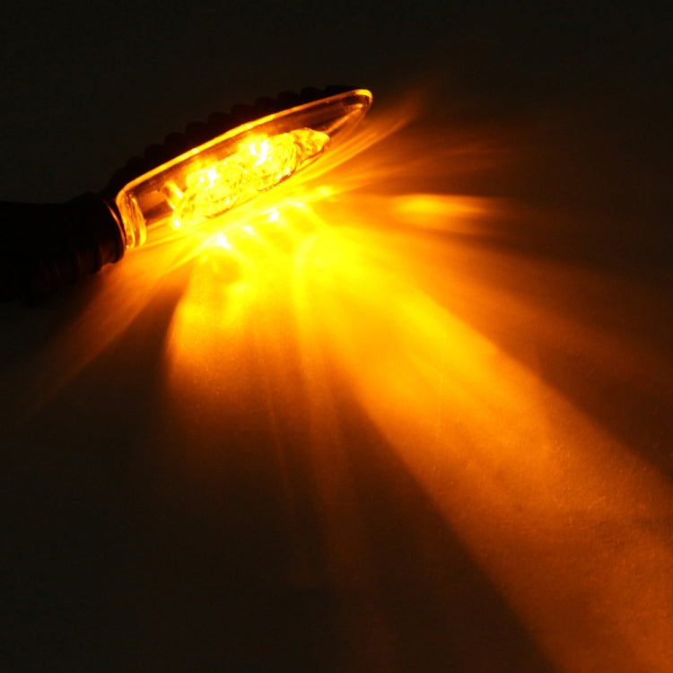Amber LED turn signal light glowing, bright lens output with light beam