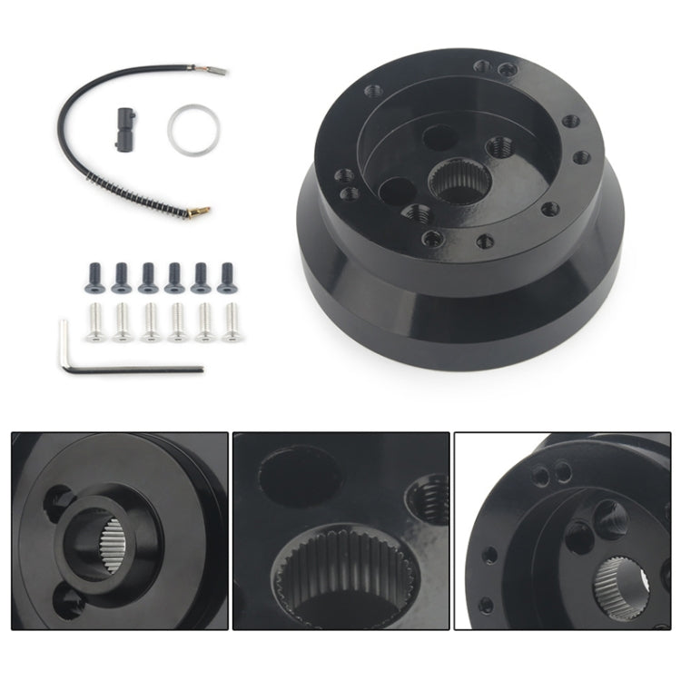 Black steering wheel hub adapter kit with wiring, screws, and front spline view