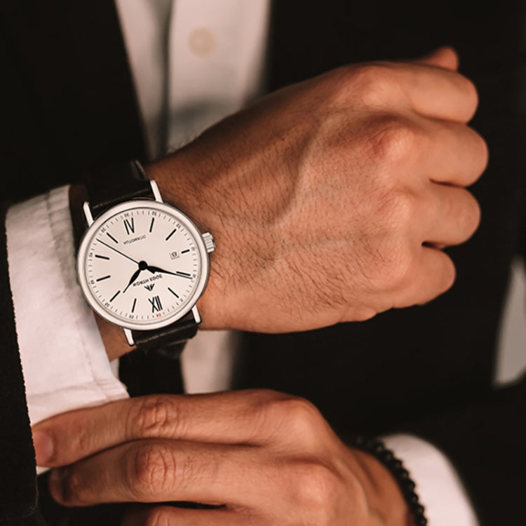 NORTH EDGE automatic men’s watch worn on wrist with black leather strap and silver dial