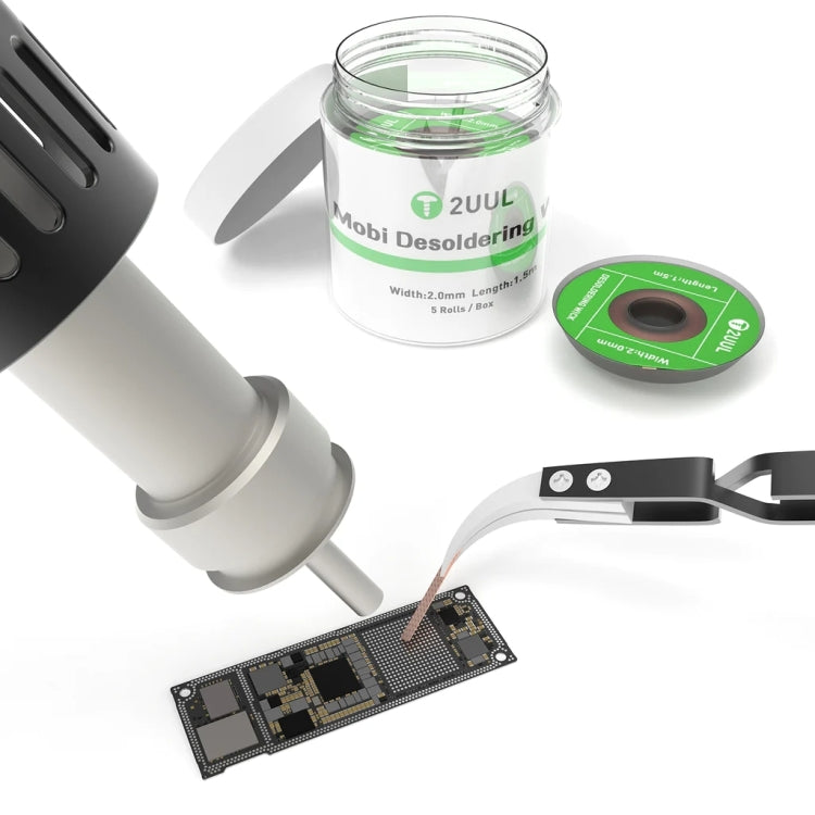 Clear jar and green 2UUL wick roll near soldering iron; PCB strip below
