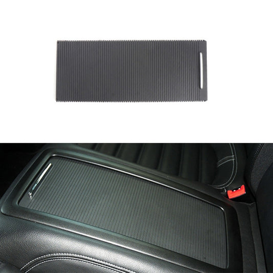 Black ribbed armrest storage box insert panel with side handle slot