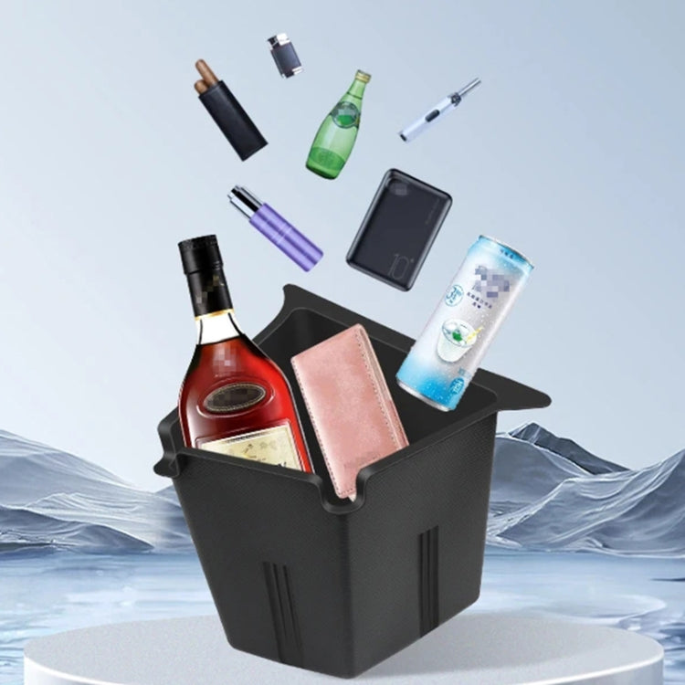 Dark trunk storage box holding bottles and phone, front and side view