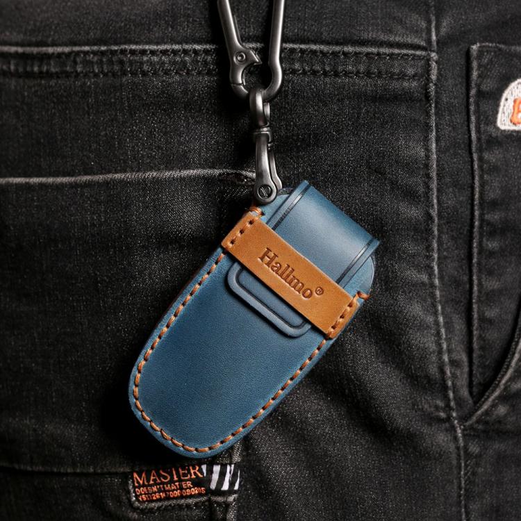 Blue leather key fob protection cover with tan patch, stitched edges, and key ring