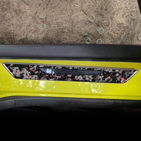 Car threshold sticker strip, carbon-fiber look with red flecks on dark trim