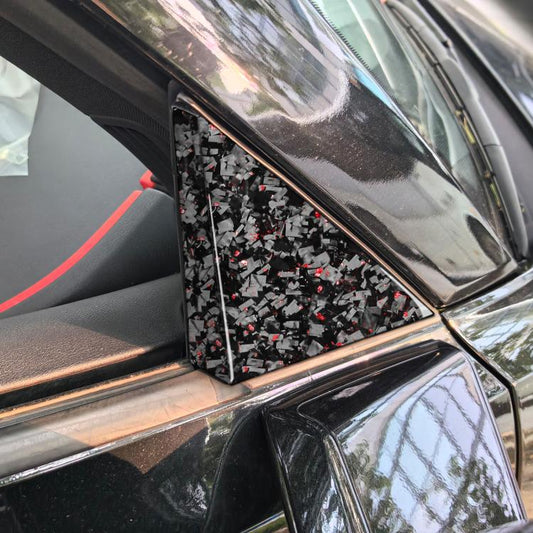 Installed triangular A-pillar sticker on car, black carbon-fiber look with red foil flecks
