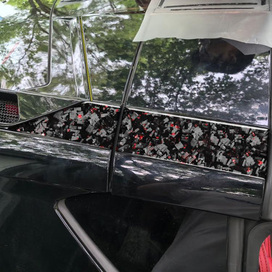 Roof side decal panel on black car door with carbon-fiber pattern and red foil accents