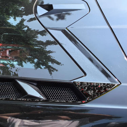 Roof engine vent sticker pair with carbon-fiber look and red accents on car
