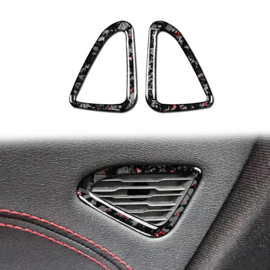 Set of two carbon-fiber door air outlet trim stickers with red speckle accents