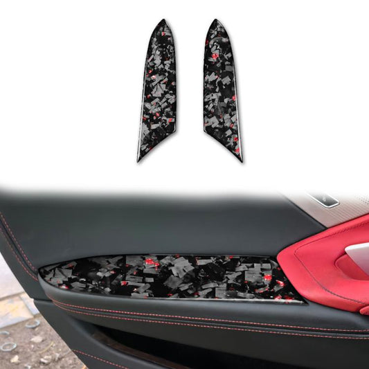 Two carbon-fiber armrest panel stickers, black with red accents (left/right)