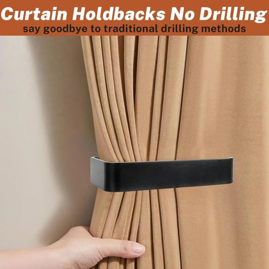 Black curtain holdback buckle with center strap holding beige curtains