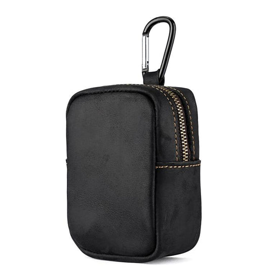 Black leather coin pouch with front zipper and metal carabiner clip.