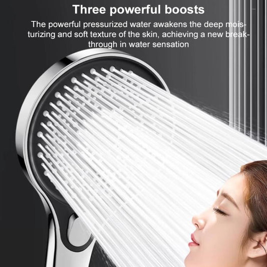 Round shower head with black perforated face, water spray streaming from the nozzle