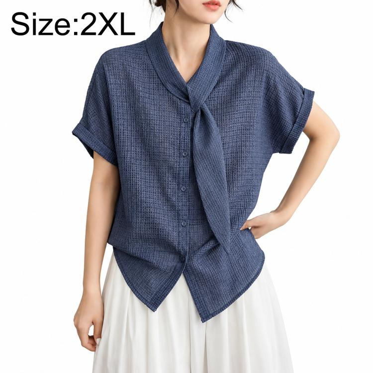 Women’s tie-neck button-front blouse in textured dark blue, model wearing size 2XL.