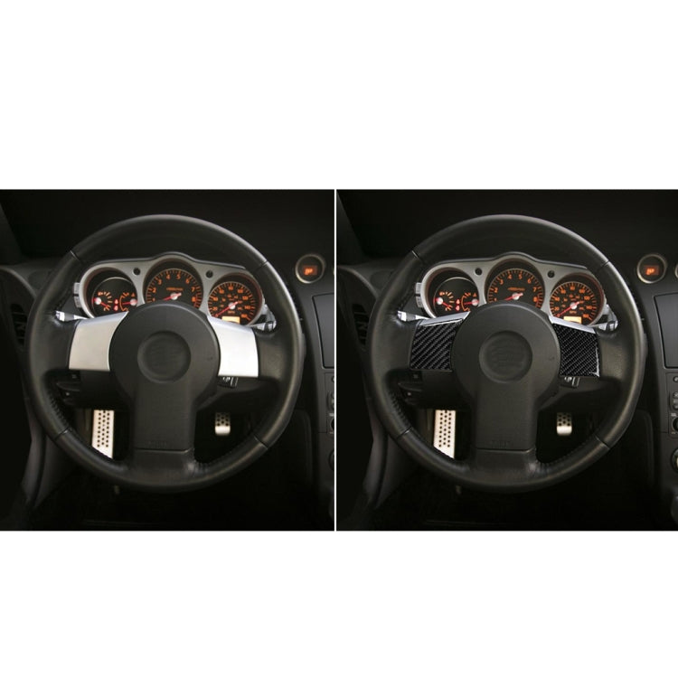 Steering wheel with dark carbon-fiber decorative inserts on spoke areas