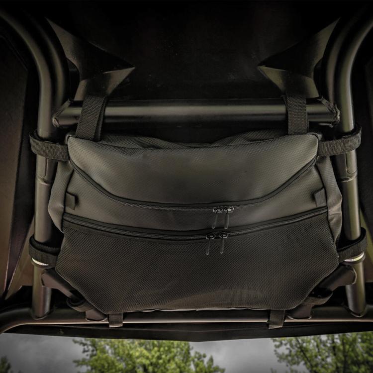 Mounted dark nylon ATV storage bag with front zipper pocket and securing straps