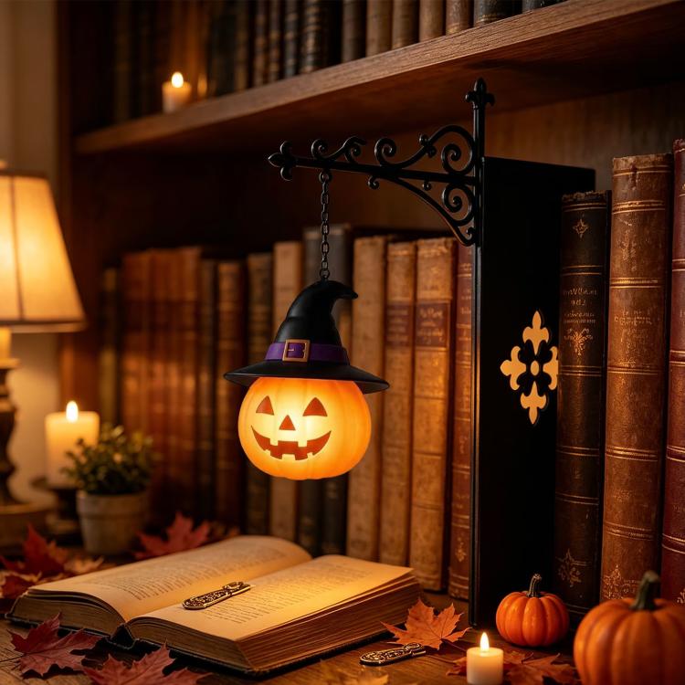 Hanging jack-o'-lantern pumpkin night light with black witch hat on chain