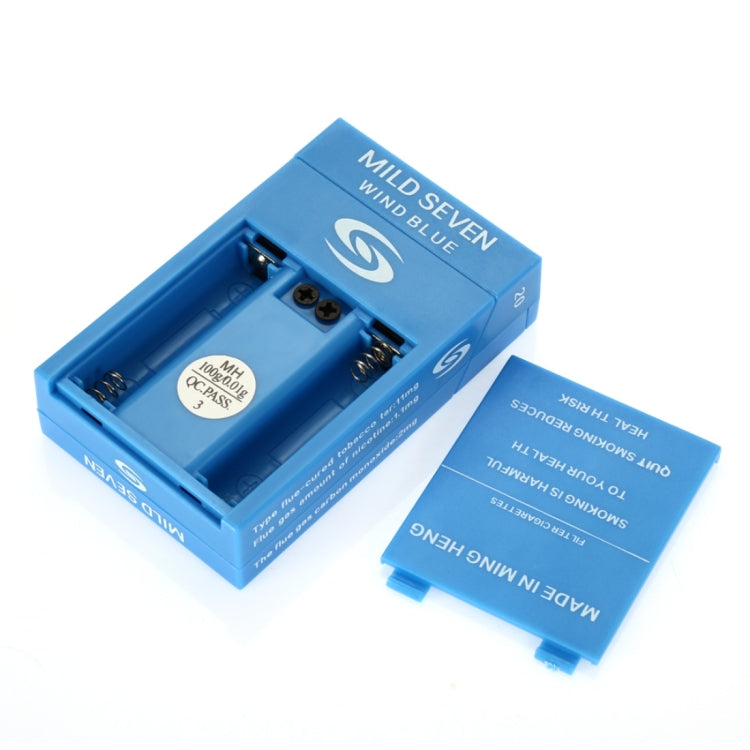 Open Mild Seven Wind Blue cigarette pack showing inner tray and insert